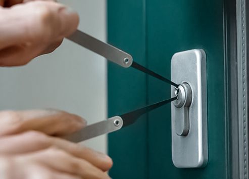 Locksmith opening a door lock during an emergency lockout