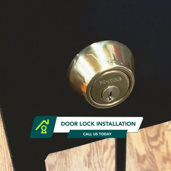 A New Gold-Colored Deadbold Lock Installed On The Door Of A Home.